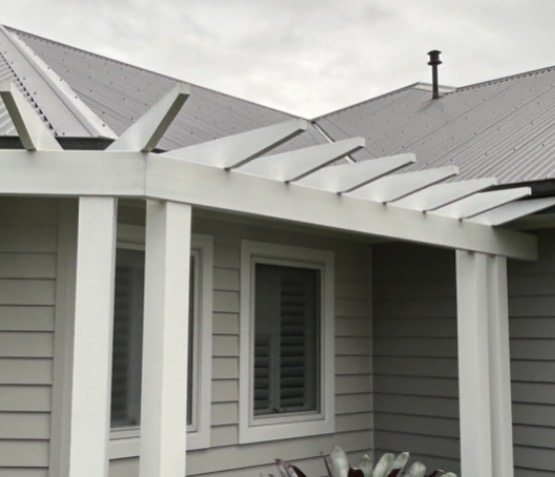 Timber patio pergola restored to clean white after soft wash