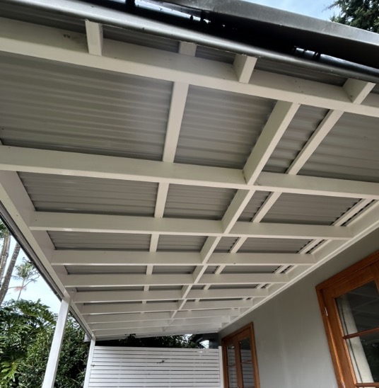 Same veranda beams and ceiling restored to bright white after cleaning